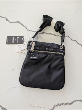 LeSportsac x tokidoki Black Tracolla Crossbody Bag with fun interior pattern